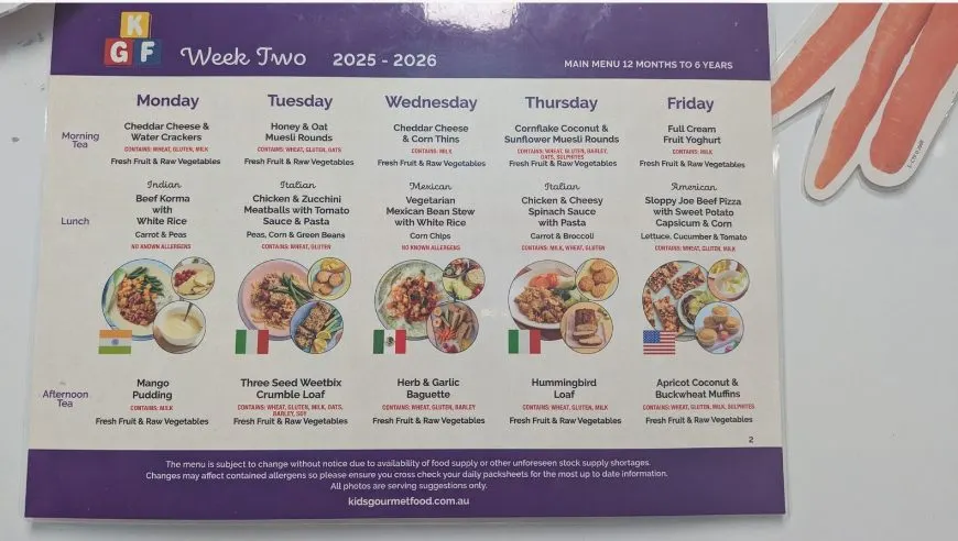 The week's Kids Gourmet Food menu on the wall, with morning tea, lunch and afternoon tea for each day