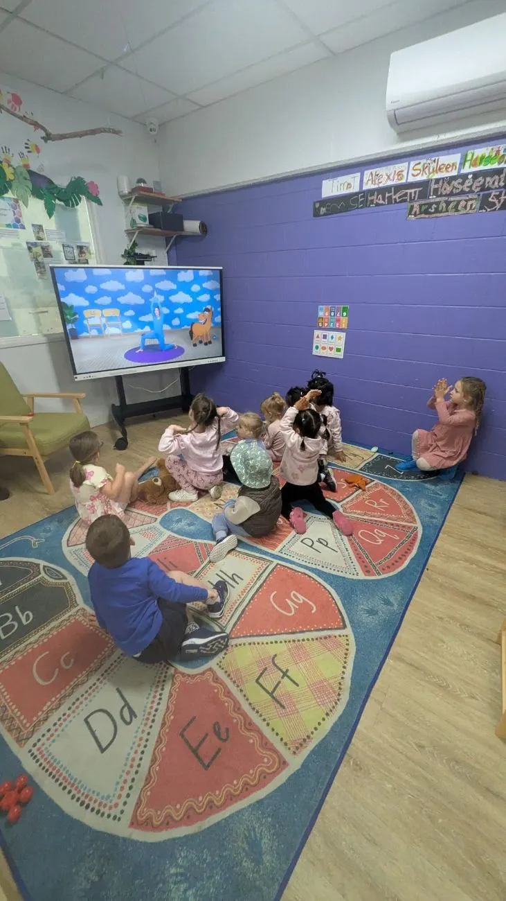 The kindy group following a yoga session on the mat