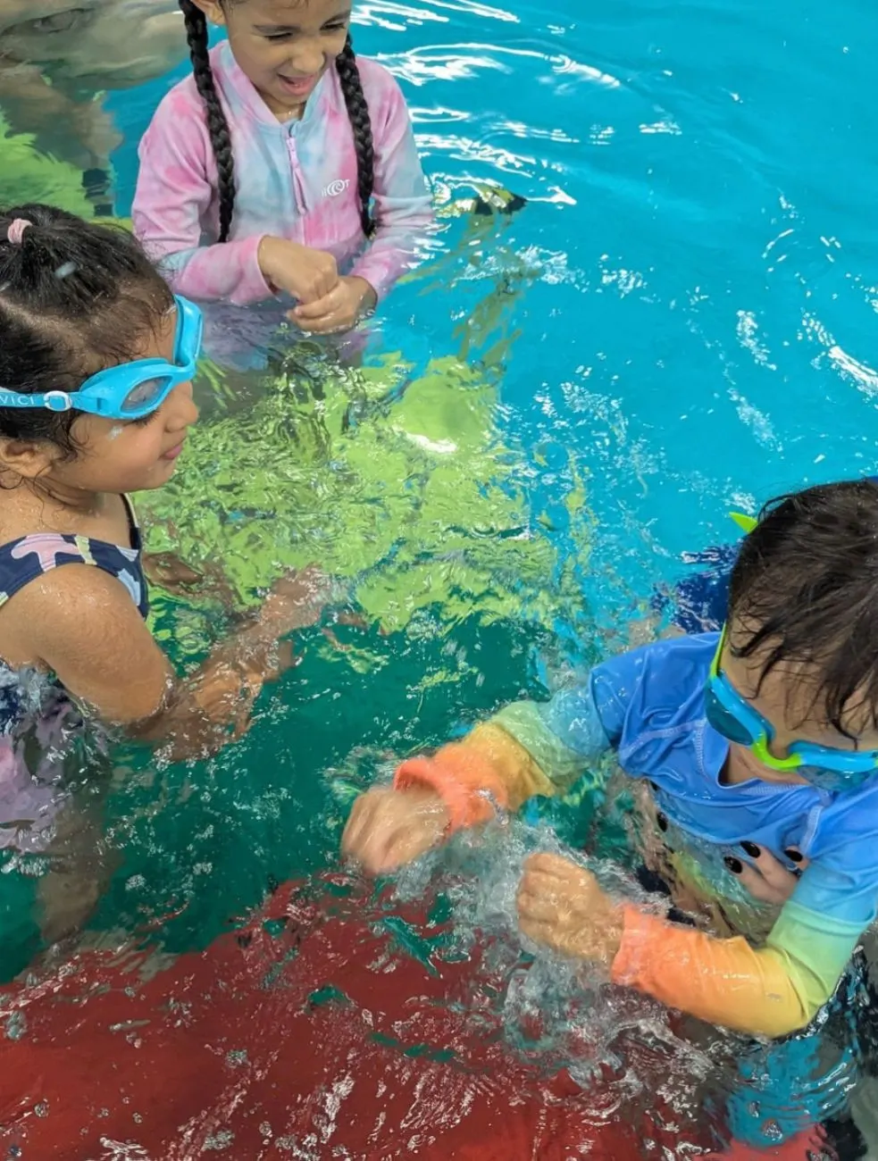Children splashing and playing in the water together